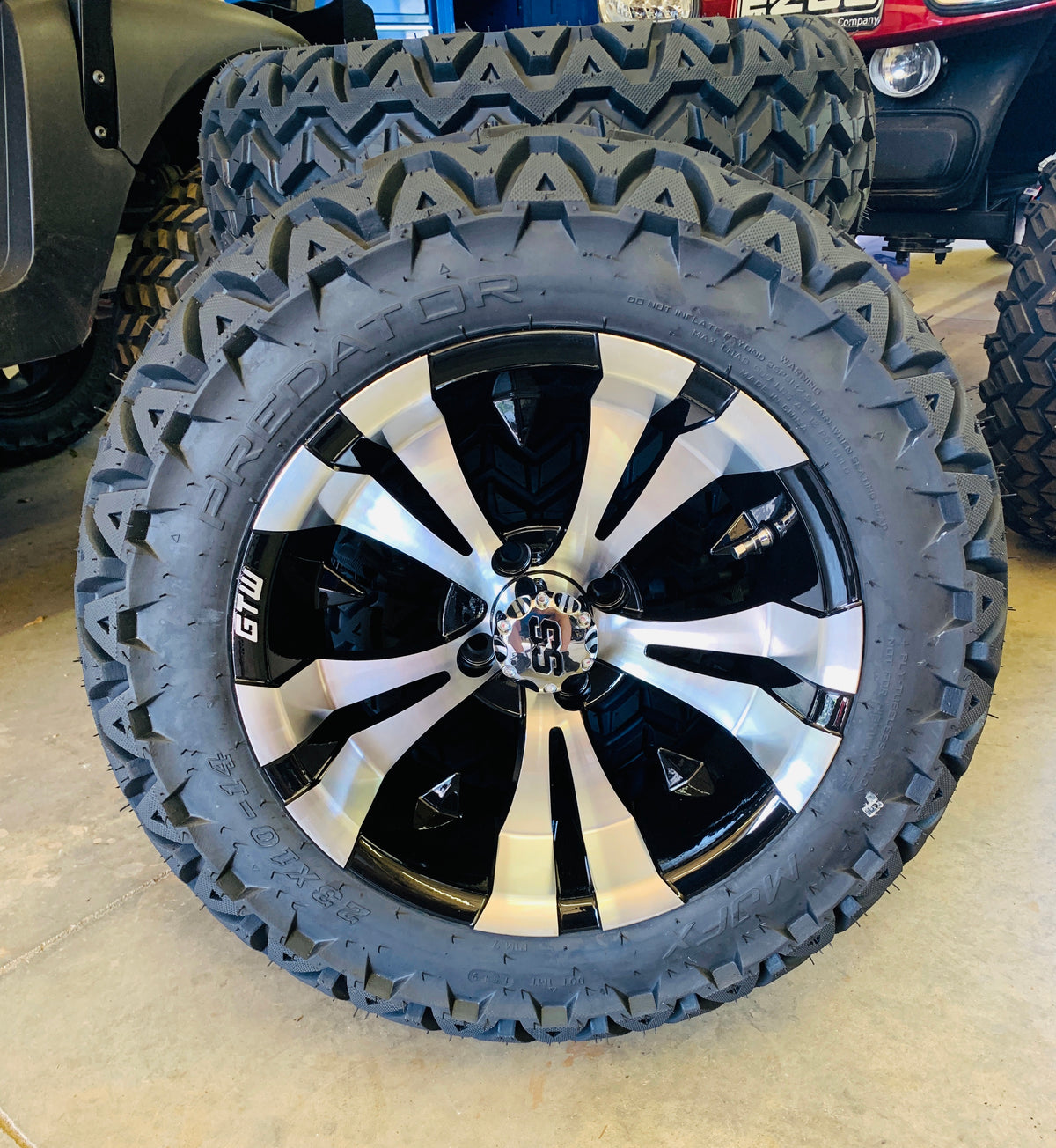 14" Vampire Black & Machine Aluminum Wheels with 23x10-14 All-Terrain Tires | Set of 4